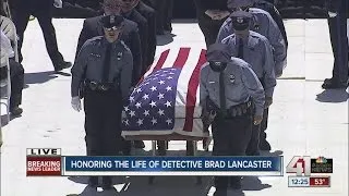 Brad Lancaster carried out of funeral