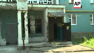 Donetsk council says 2 killed by shelling in rebel-held city; block of flats hit; residents' reactio