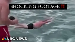 Video appears to show a man trying to body-slam an orca