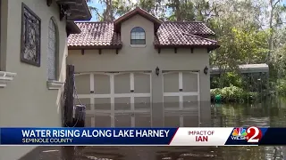 Water rises along Lake Harney forcing some Seminole County residents to use boats