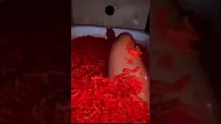 Woman takes a bath in hot cheetos