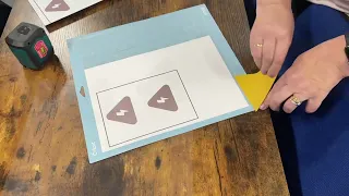 Cutting the vinyl using a vinyl cutting (die cutting) machine.