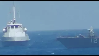 Watch as the US Navy fires warning shots toward an Iranian patrol boat