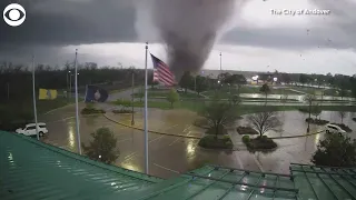 Tornado uproots trees as it rips through city in Kansas