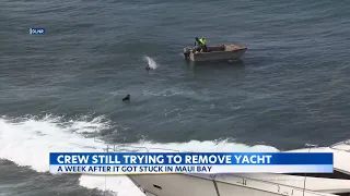 After a week, crews still working to get Maui yacht out of Bay