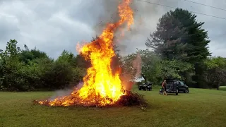 Henry burns a large brush pile.