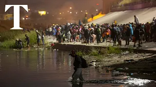 Migrants wade across Mexico's Rio Grande to El Paso in Texas