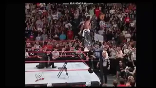 Sabu leg drops John Cena through Announce table