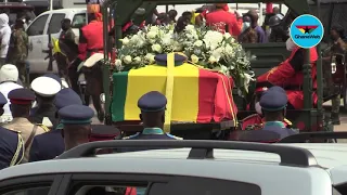 Military Pallbearers lift Rawlings' casket for burial