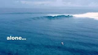 Surfing a perfect right alone in The Maldives....