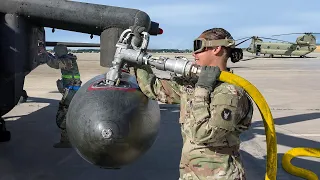 Fueling Massive External Tanks of US Assault Helicopter Before Mission Takeoff