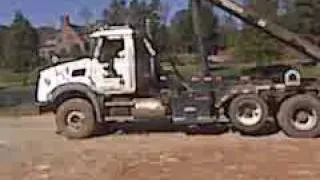 ROLLOFF TRUCK DOING A WHEELIE