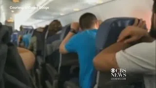 Watch: Passengers brace for emergency plane landing