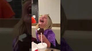 Little girl laughing at McDonald’s