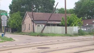 Near Northside neighbors concerned as splintered utility pole left leaning on cables