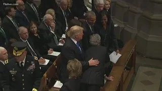 President Bush greets fellow presidents, slips candy to Michelle Obama