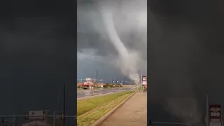 Sirens blare in this tornado towering over the city.