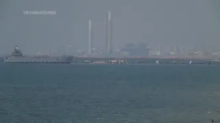 Palestinians in central Gaza wait for aid trucks to roll off pier built by US