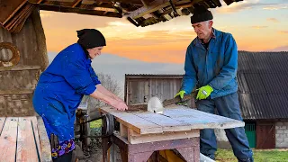 Amazing old age of an elderly couple side by side. Daily hard life in a high mountain village