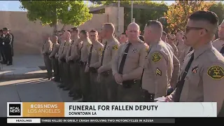 Law enforcement and community members gather ahead of Dep. Ryan Clinkunbroomer's funeral