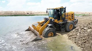 Invincible Skills Operator Strong Power Wheel Loader Spreading Rock Soil Into Water New Road Build