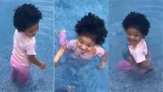 Stormi Webster Jumps in the Pool with her Clothes On