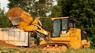 CAT 963D Track Loader Loading Dumptrucks