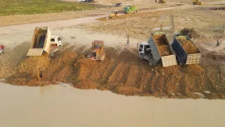 Incredible Mighty Mini Komatsu Dozers Unloading filling land by pushing dirt to water,