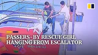 Passers-by rescue girl hanging from escalator in China