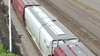 (Northbound) BNSF Grain Train passes through 21ST Street.