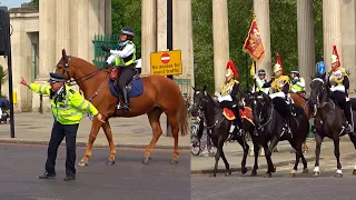 "GO NOW!" Police clear the way for The Household Cavalry