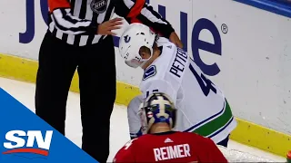 Elias Pettersson Exits Game After Getting Slammed To The Ice By Matheson