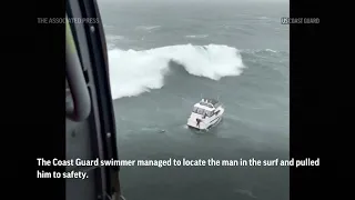 Huge wave capsizes boat as rookie U.S. Coast Guard swimmer rescues man from ocean