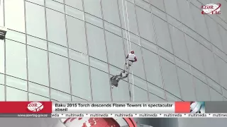 Baku 2015 Torch descends Flame Towers in spectacular abseil