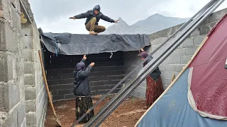 Rasool's family's grief over Sajjad's disappearance and trying to build a shelter in the rain