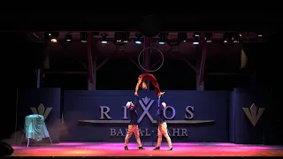 Acrobatic Dance trio with ballance stick at attention