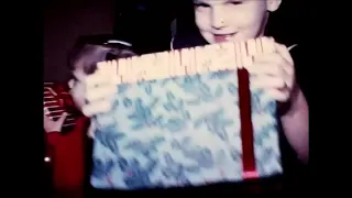 Lisa's 8mm Finds Christmas tree and presents helping with a shoe 1979