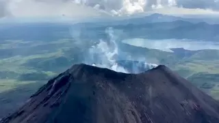 Дымит Карымский вулкан Камчатка  Above the crater of the Karymsky volcano Kamchatka