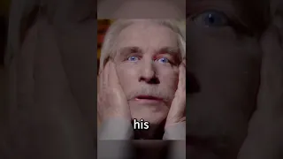 Man presses doll's eyes to his face