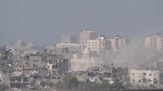Israeli artillery fires into northern Gaza, seen from Sderot | AFP
