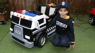 SAMI plays with his new police truck