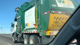 Waste Management’s Mack MRU McNeilus Half Pack Front Loader Garbage Truck