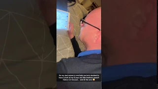 Dad checks the history of his 8 year old son 's iPad