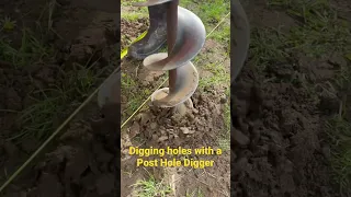 Digging holes with a post hole digger. #postholedigger