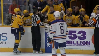 Referee Tim Peel gets repairs from Predators bench, stays in game