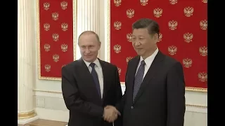 Xi, Putin Promise to Boost Coordination on Major Issues