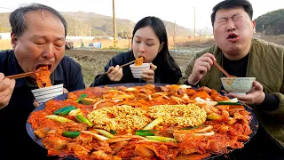 Hot spicy pork and kimchi stew cooked on a cauldron lid - Mukbang eating show