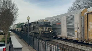 A intermodal train overtakes a autorack train at Spartanburg SC￼