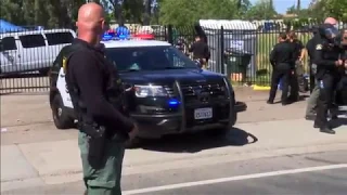 Activists protest while Sacramento Sheriff's Deputies close homeless camp