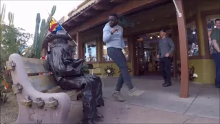 He freaked out!  Friends set him up, statue prank.